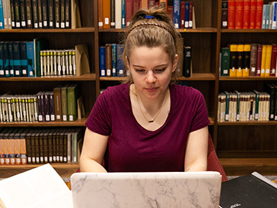 MDiv student studying in library